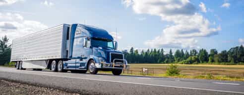 Blue semi-truck on highway